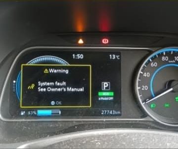 Nissan Leaf dashboard showing a system fault warning before repair